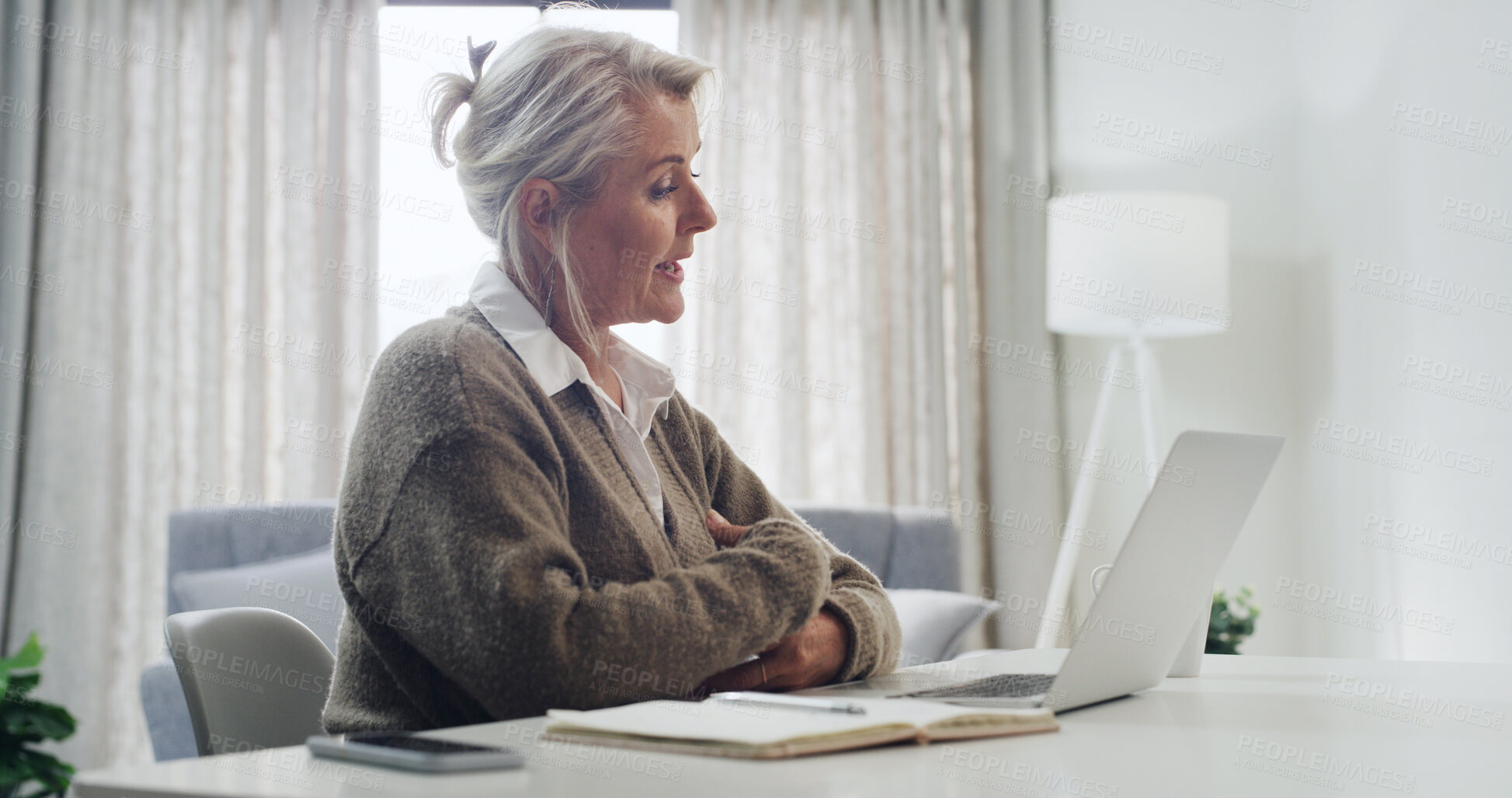 Buy stock photo Laptop, talking and video call with woman in home office for online communication or remote work. Computer, conversation and discussion with mature freelancer in apartment for virtual meeting