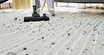 Person, feet and cleaning mat with vacuum in home for housekeeping, chores or hygiene. People, cleaner or suction with equipment, carpet or rug for tidy space, dirt or dust removal on floor in house