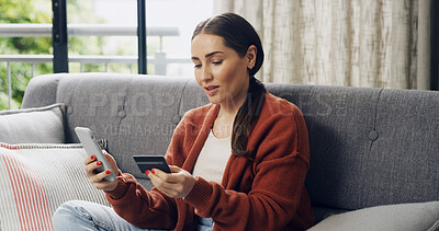 Buy stock photo Credit card, ecommerce and phone with woman on sofa in living room of home for checkout. App, online shopping and purchase with happy customer in apartment for payment, transfer and transaction