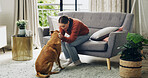 Happy woman, play and care for dog on sofa, love and stroke for trust in living room at apartment. Person, pet animal and connection in lounge with loyalty, touch or bonding on couch in house