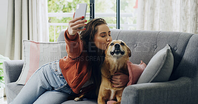 Buy stock photo Woman, dog and selfie on sofa with kiss in home, hug and excited for post on web in living room. Person, love and photography with pet animal on couch, profile picture or social network at apartment