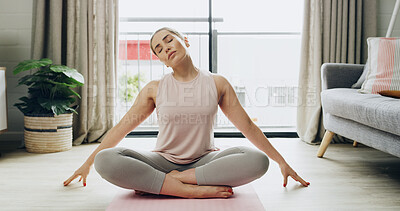 Buy stock photo Yoga, stretching and woman in home, fitness or improve posture in living room, routine and wellness. Healthy, person and exercise to release stiff neck, balance and relax muscle tension with pilates
