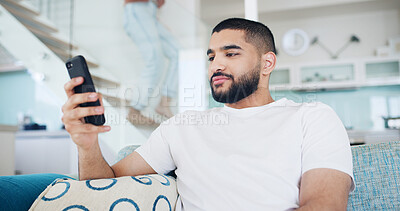 Buy stock photo Home, smartphone and man on sofa, typing and relax with social media, internet and connection. Apartment, communication or person on couch, cellphone or message to contact, network or app for texting