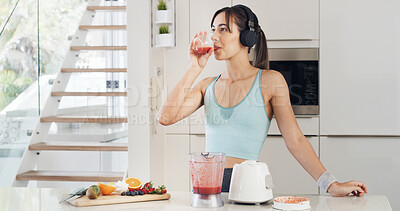 Buy stock photo Headphones, drinking smoothie and woman with healthy diet, nutrition and fruit in kitchen. Taste, blender and female person with vegan ingredients for drink, shake or streaming music in home