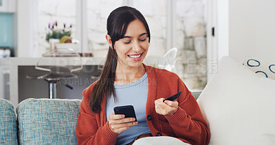 Buy stock photo Woman, phone and happy with credit card on sofa for online shopping, deal or easy payment in home. Girl, smartphone and smile with e commerce, sale or bills on fintech app with banking at apartment