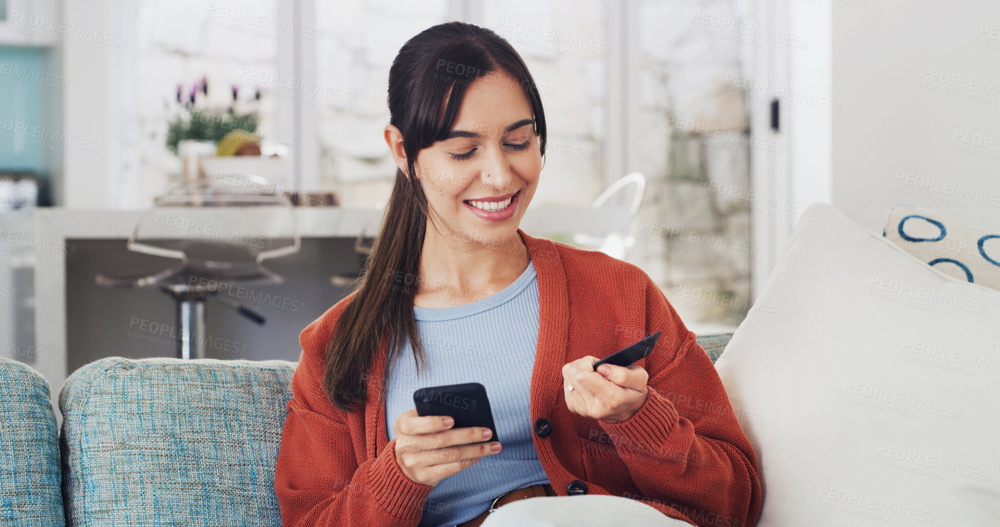 Buy stock photo Woman, phone and happy with credit card on sofa for online shopping, deal or easy payment in home. Girl, smartphone and smile with e commerce, sale or bills on fintech app with banking at apartment