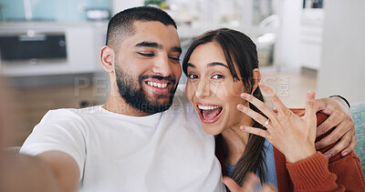 Buy stock photo Couple, selfie and engagement ring in living room for commitment, romance and love on social media app. Man, woman and excited for marriage proposal, portrait and celebration with smile for blog