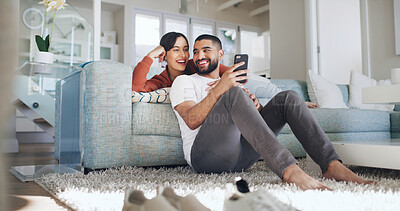 Buy stock photo Phone, smile and text message with couple on sofa in living room of home together for social media browsing. App, communication or relax with man and woman in apartment for bonding or wellness