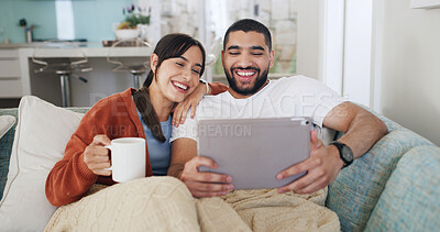 Buy stock photo Home, video call and couple on sofa, tablet and relax with communication in living room. Apartment, coffee and man on couch, woman and tech for online chatting, conversation and happiness with app