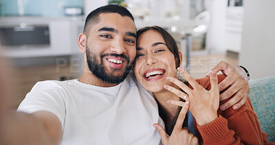 Buy stock photo Couple, selfie and engagement ring with portrait for commitment, romance and love on social media app. Man, woman and excited for marriage proposal, celebration and smile for blog in living room