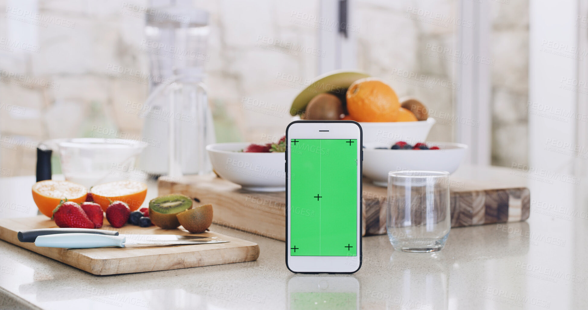 Buy stock photo Green screen, smoothie and phone on kitchen counter for healthy diet, nutrition and fruit in house. Recipe, blender and technology with vegan ingredients for blog, shake or ui for tips in home