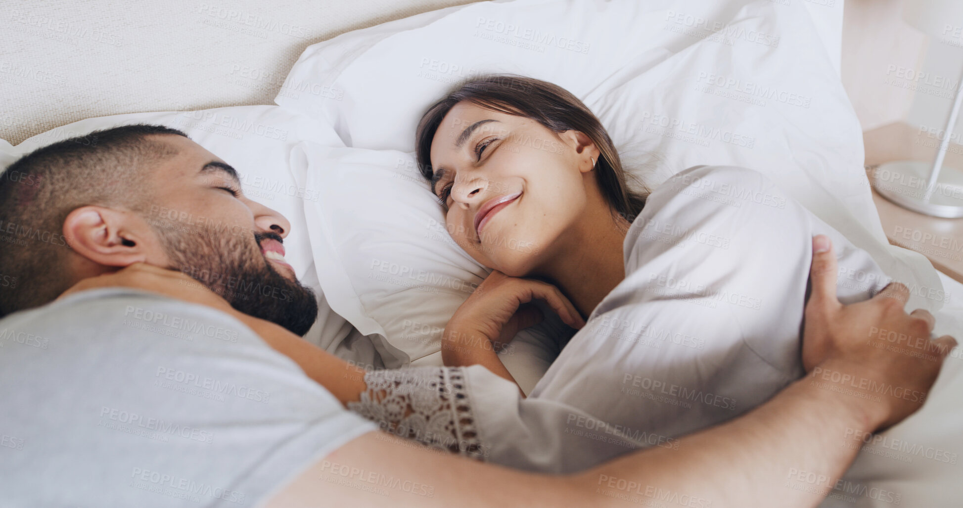 Buy stock photo Happy, couple and relax in bedroom at house with love, wake up and calm morning on honeymoon. Smile, people and rest for romantic moment, partner affection and bonding together of marriage commitment