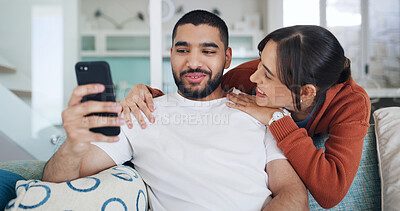 Buy stock photo Smile, couple and selfie in living room for love, care or post on social media for relationship. Photo, man and woman in home with profile picture, relax and embrace partner for memory together