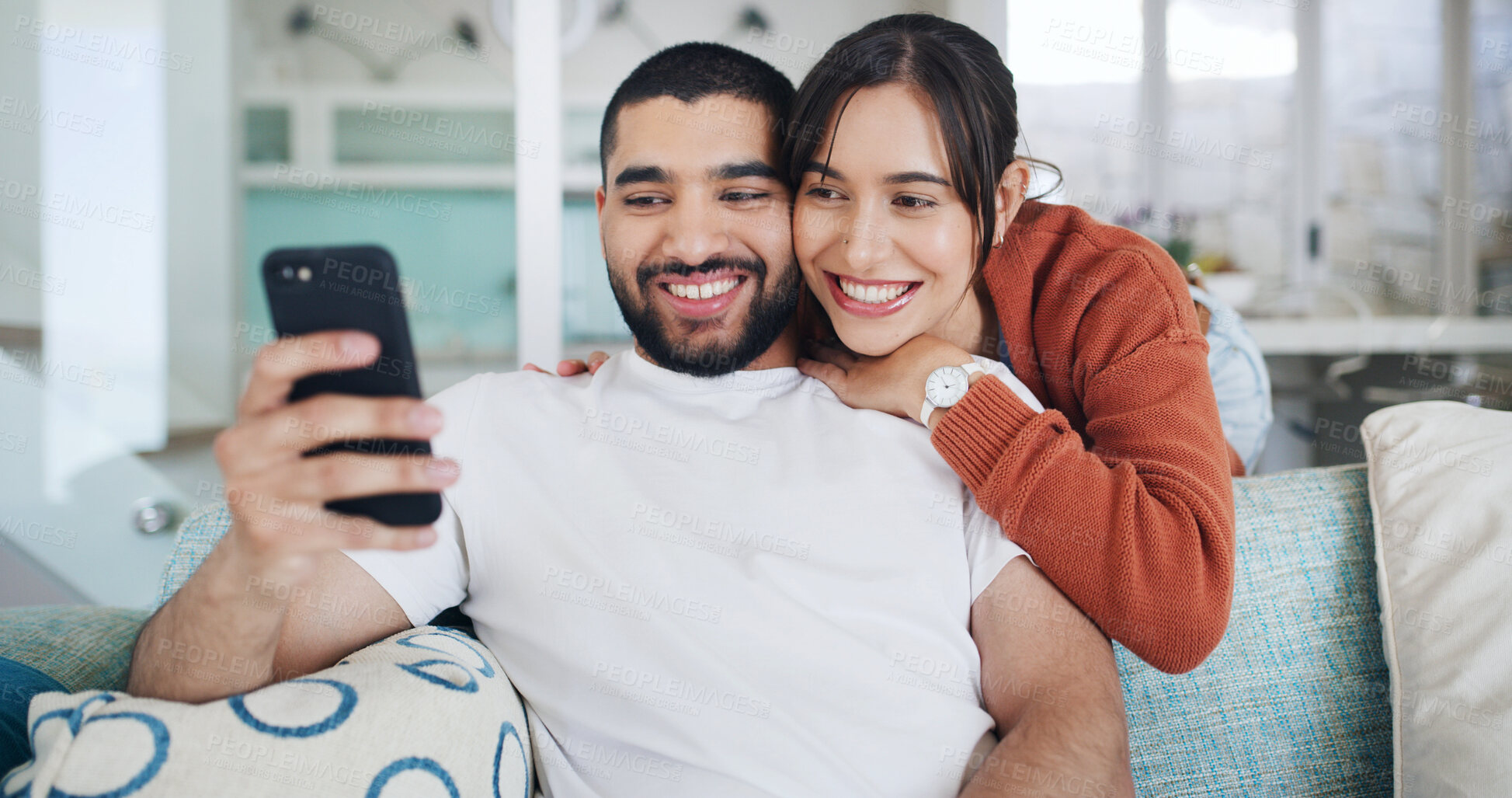 Buy stock photo Smile, couple and selfie in home for love, care or post on social media for relationship. Photo, man and woman in living room with profile picture, relax and embrace partner for memory together