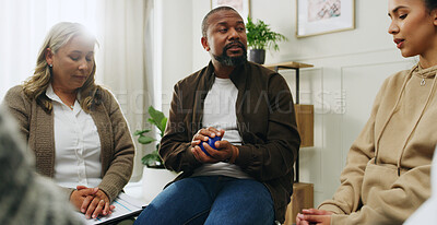 Buy stock photo People, talk and therapist for group counseling with stress ball, mental health and anxiety relief. Man, speaking and community for therapy session, wellness support and technique for coping strategy
