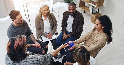 Buy stock photo Speaker, therapy and ball with people in support group for meeting, healing and community. Counseling session, solidarity and rehabilitation workshop with above of men and women for wellness