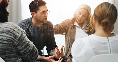 Buy stock photo Support, group counseling and sad man in circle for addiction recovery, share story or comfort. Psychology, people and therapy for help with alcoholic rehabilitation in community center with flare