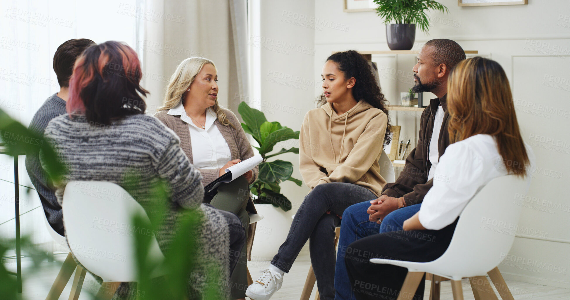 Buy stock photo Therapist, counseling and group of people in office with support, help or mental health development. Communication, men and women in meeting with psychologist, discussion or listening to advice.