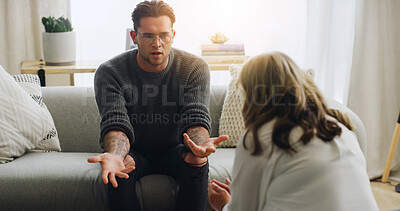 Buy stock photo Counseling, therapist and man with stress on sofa for mental health, explain story and expert advice. Psychology, people and psychologist in clinic for trauma therapy, patient evaluation and support