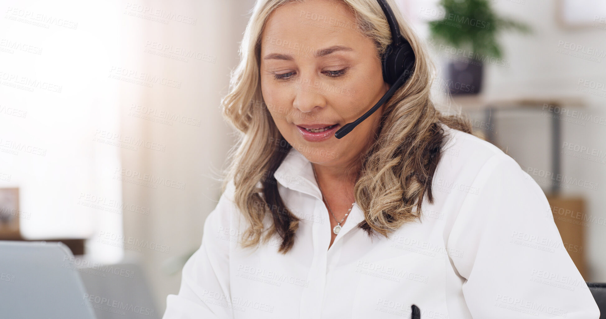 Buy stock photo Psychologist, woman and video call with laptop in office for online support, advice and assessment. Psychology, mature person and headset with virtual consultation for therapy and progress follow up