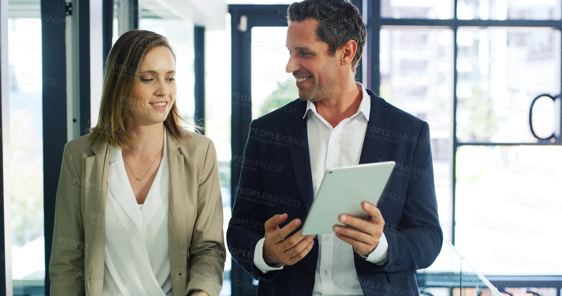 Buy stock photo Businessman, woman and smile with tablet, talk and feedback with risk assessment app at company. People, team and tech with discussion, happy and insight with problem solving at insurance agency