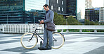 Bike, phone and business man in city for carbon footprint, communication and eco friendly commute, Sustainability travel, cycling and online with male person outdoor for professional csr journey