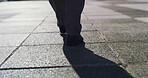 City, legs and business person walk for travel, urban journey or morning commute on sidewalk. Back, shoes and worker on street outdoor with professional, pedestrian and trip for corporate career path