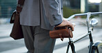 Bike, hands and business man in city for carbon footprint, bicycle or eco friendly commute, Sustainability travel, cycling and trip with person outdoor for professional csr transport and career