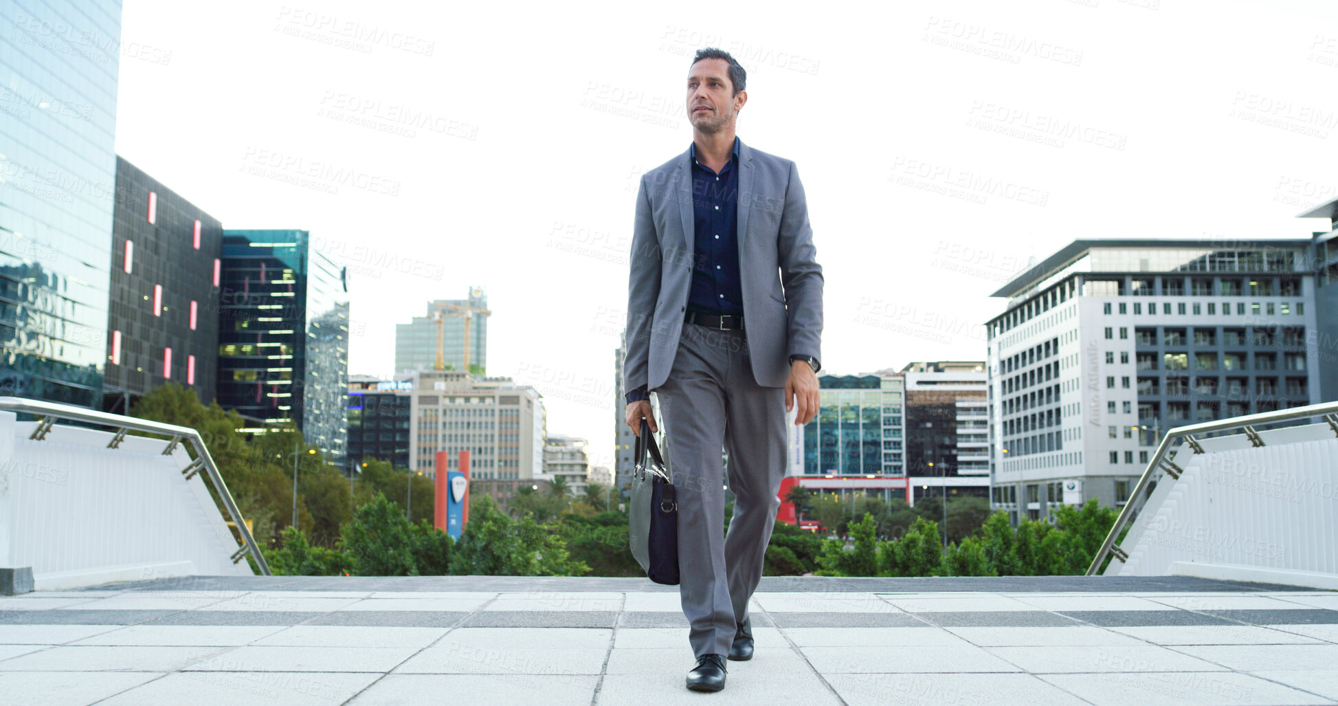 Buy stock photo Business man, thinking and walking in city for property viewing, idea and planning outdoor. Urban development, male realtor and mature real estate investment with suitcase for commute and opportunity