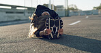 Fitness, woman and stretching on road for wellness, health and preparation for exercise in city. Sports, athlete and seated forward bend for flexibility, warm up legs or runner outdoor on street