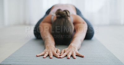Buy stock photo Hands, yoga and woman with stretching in childs pose on exercise mat, health and peace in home. Female person, wellness and posture with muscle relief, fitness or position for self care in apartment