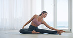 Woman, stretching and yoga in home for meditation, healing and peace or mental health. Female person, zen and flexibility on floor for chakra, calm energy and mindfulness or pilates exercise in house