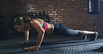 Sports, push up and portrait of woman in gym with workout, health or body training for strength. Strong, athlete and female person with arm exercise for wellness with challenge in fitness center.