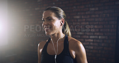 Buy stock photo Earphones, smile and workout with woman in gym for streaming fitness playlist, health and audio. Wellness podcast, flare and athlete or person and music in sports club for exercise and radio