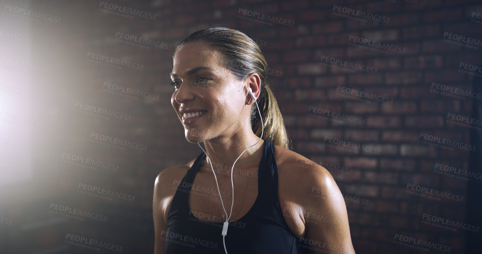 Buy stock photo Earphones, smile and workout with woman in gym for streaming fitness playlist, health and audio. Wellness podcast, flare and athlete or person and music in sports club for exercise and radio
