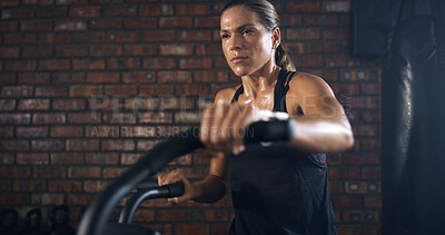 Buy stock photo Thinking, woman and fitness with bicycle at gym for exercise, intense training and endurance. Female person, sweating and stationary bike for cardio workout, cycling performance and sports challenge