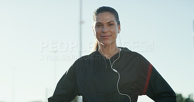 Buy stock photo Portrait, music and runner with woman in city for workout playlist, streaming service and health. Exercise podcast, audio subscription and wellness radio with person and earphones outdoor for space