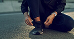 Hands, runner and tie shoelaces in street, bridge and reflection with fitness routine in morning. Person, athlete and ready for training in road, exercise and start workout for wellness in city