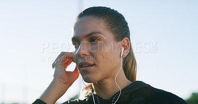 Buy stock photo Thinking, earphones and runner with woman in city for workout playlist, streaming and health vision. Exercise podcast, audio subscription and reflection with person and music outdoor for space