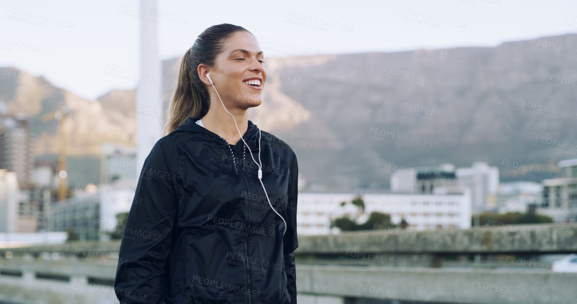Buy stock photo Smile, music and runner with woman in city for workout playlist, streaming service and health. Exercise podcast, audio subscription and wellness radio with person and earphones outdoor for sound
