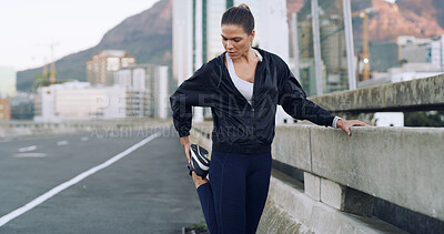 Buy stock photo Runner, woman and stretching legs on road for wellness, health or exercise preparation outdoor. Sports, fitness and warm up muscle on street for flexibility, challenge or practice on city bridge