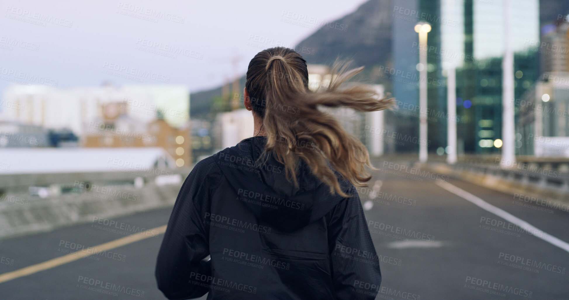 Buy stock photo Back, running and woman in city for exercise, cardio health and wellness outdoor. Road, marathon preparation or endurance training with runner on urban street for sport, workout and fitness on bridge