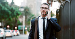 Phone call, talking and businessman in city with communication, networking or contact for deal. Walking, cellphone and male financial manager on mobile discussion for finance negotiation in town.