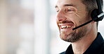 Headset, happy and call center consultant in office with communication, crm or online consultation. Smile, technology and male customer support agent with internet query for help desk in workplace.