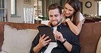 Tablet, hug and couple on sofa in home with social media, networking or communication online. Smile, love and man with woman on digital technology for contact in living room together at apartment.