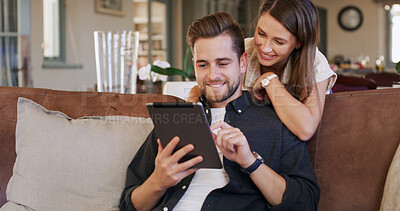 Buy stock photo Tablet, hug and couple on sofa in home with social media, networking or communication online. Smile, love and man with woman on digital technology for contact in living room together at apartment.