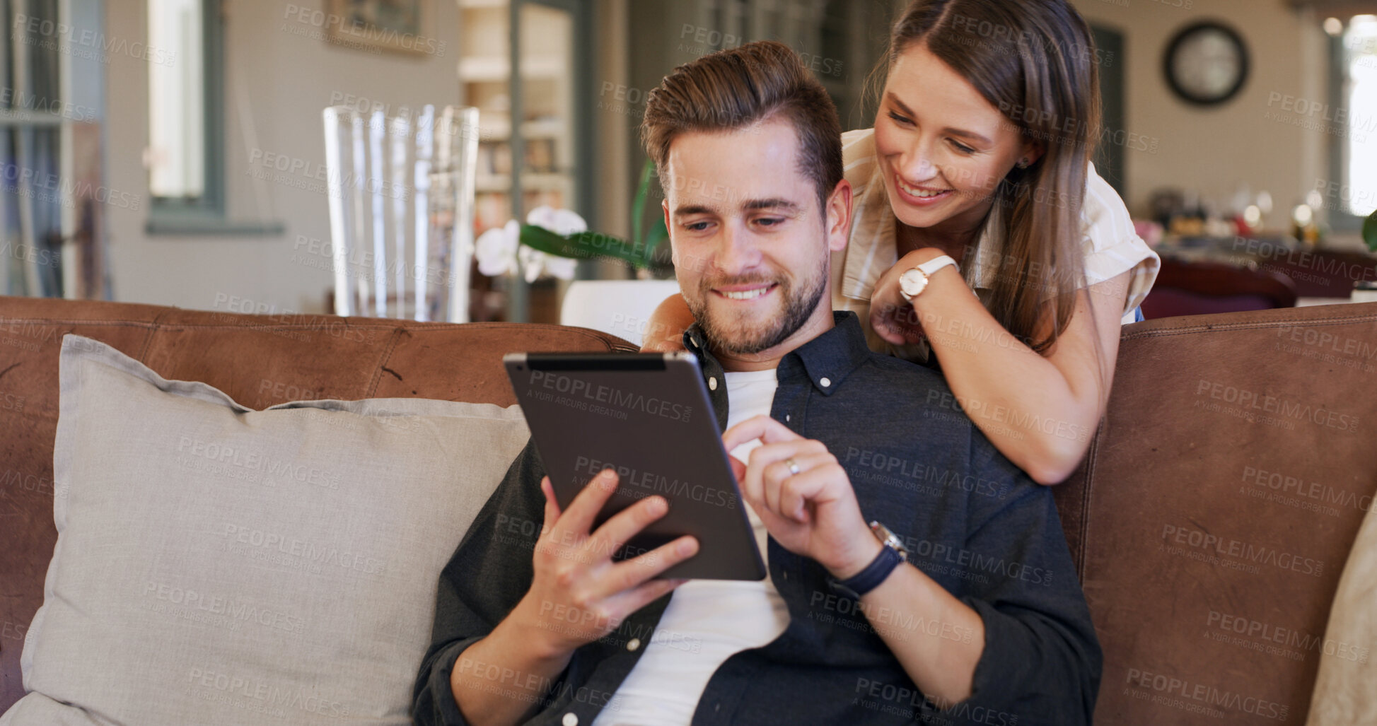 Buy stock photo Tablet, hug and couple on sofa in home with social media, networking or communication online. Smile, love and man with woman on digital technology for contact in living room together at apartment.