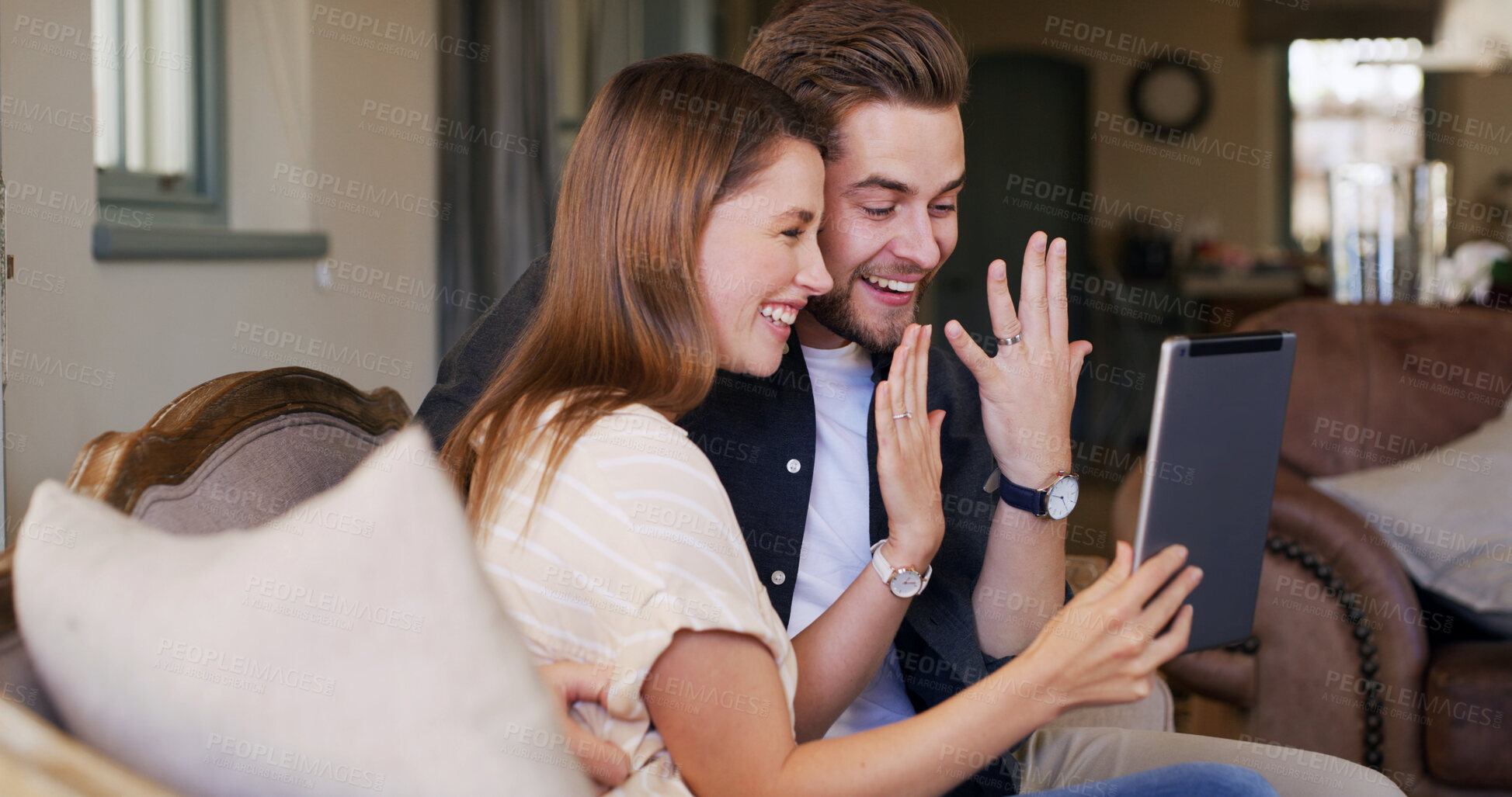 Buy stock photo Excited couple, engagement ring and video call on tablet in house living room for announcement. Smile, celebrate or happy people speaking online for relationship, marriage and virtual chat together
