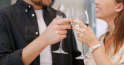 Buy stock photo Hands, cheers and couple with wine in home to celebrate anniversary, bonding and relationship. Happy, love and man with woman toast with alcohol drink for connection, commitment and romance in house