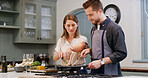 Couple, food and help with cooking in kitchen for dinner date, meal preparation and bonding. Love, people and happy with ingredients in home for healthy diet, nutrition and lunch recipe with support